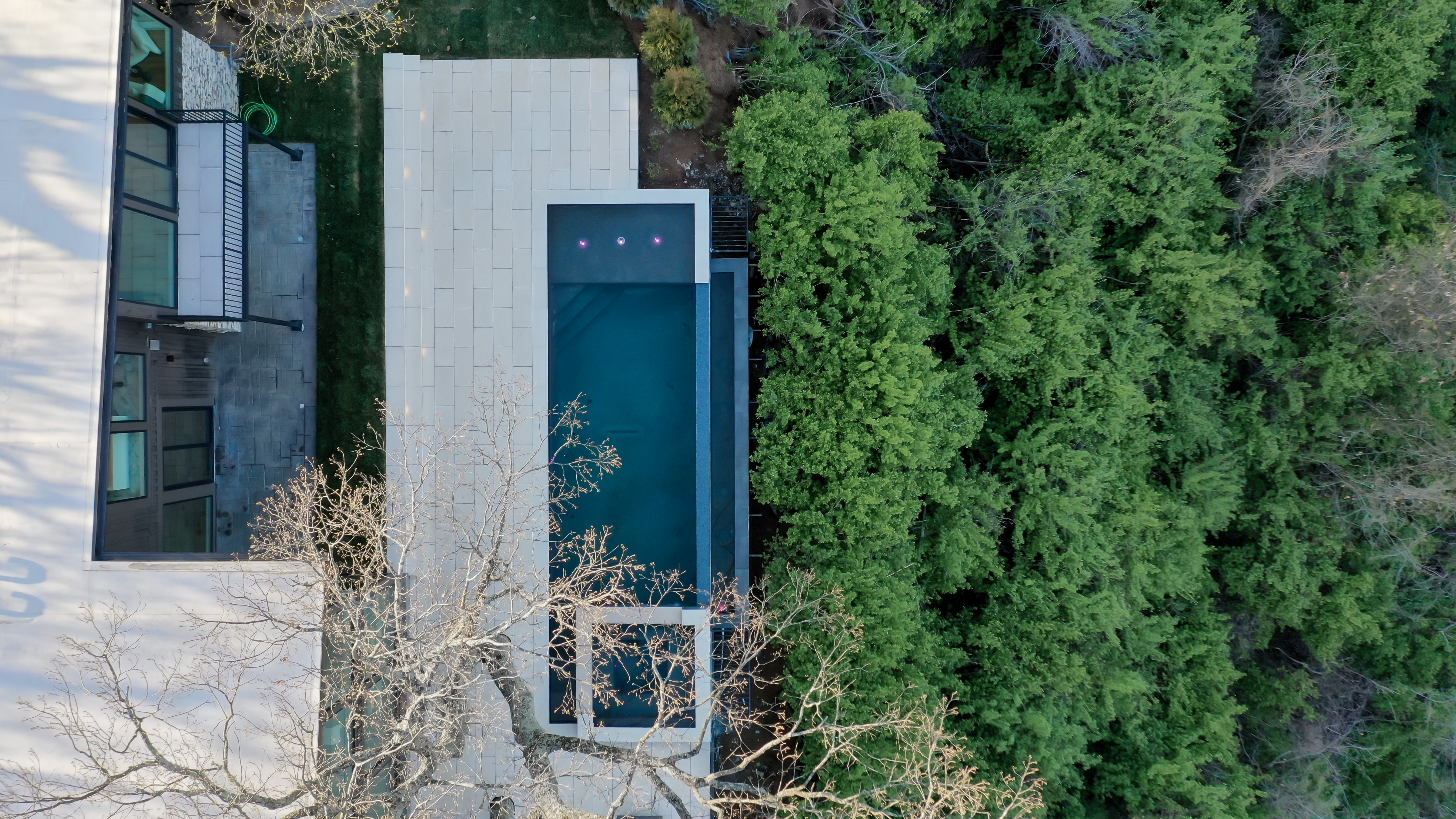 Pool at dusk with fire features